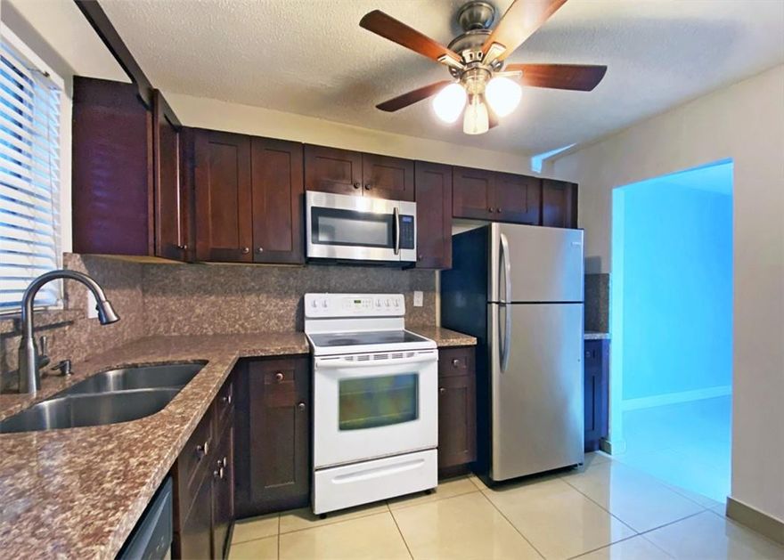 Beautiful Condo Apartment – excellent location.  Spacious corner unit 2 bedroom/ 2 bathroom.  Investor’s opportunity, it can be rented immediately; or a very nice place to call home.  Nice kitchen with granite countertops, all tile floors, enclosed balcony with view to the nice swimming pool area.  Water & trash included.  Recently painted.  Location, location, close to main highways, shopping, restaurants, colleges, hospitals, etc.
