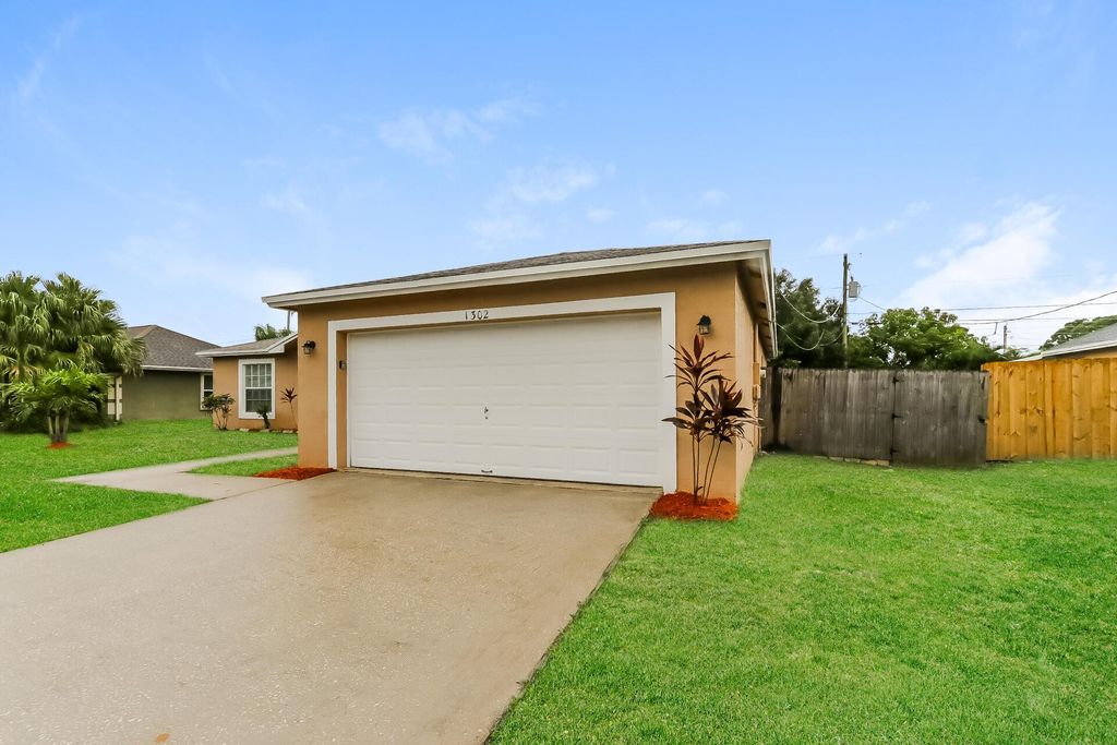 Photo of 1302 SW Amboy Avenue, Port Saint Lucie, FL 34953 (MLS # R11147978)