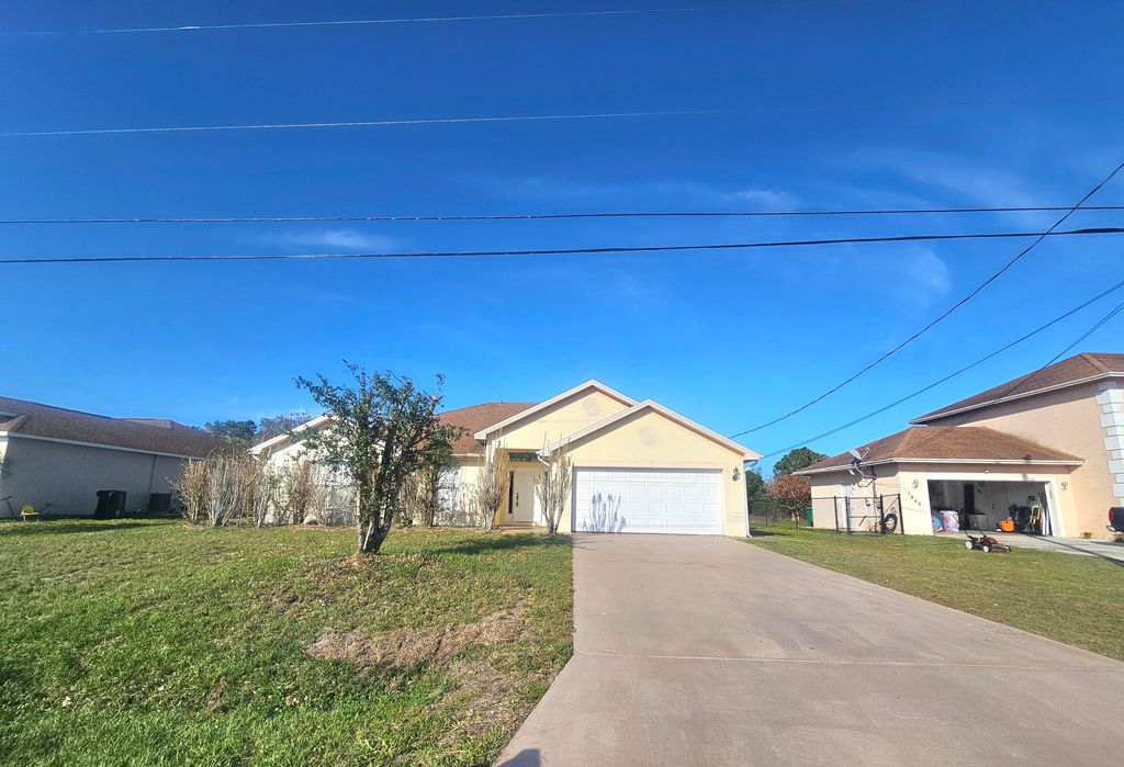 Photo of 1941 SW Hampshire Lane, Port Saint Lucie, FL 34953 (MLS # B26027623)