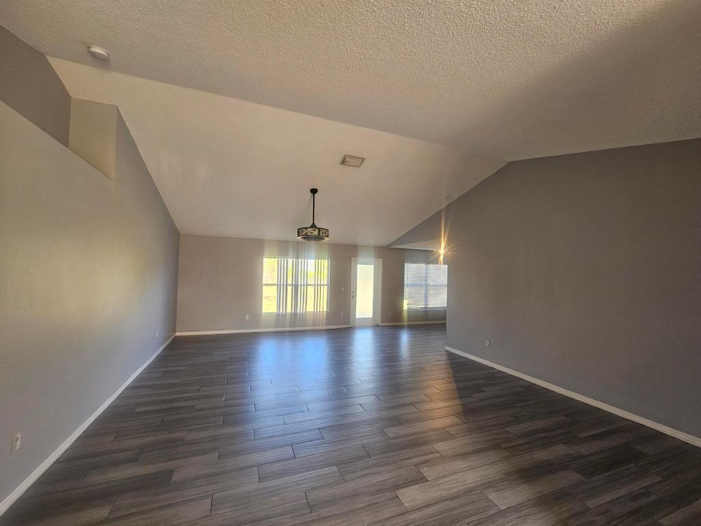 Photo of 1941 SW Hampshire Lane, Port Saint Lucie, FL 34953 (MLS # B26027623)