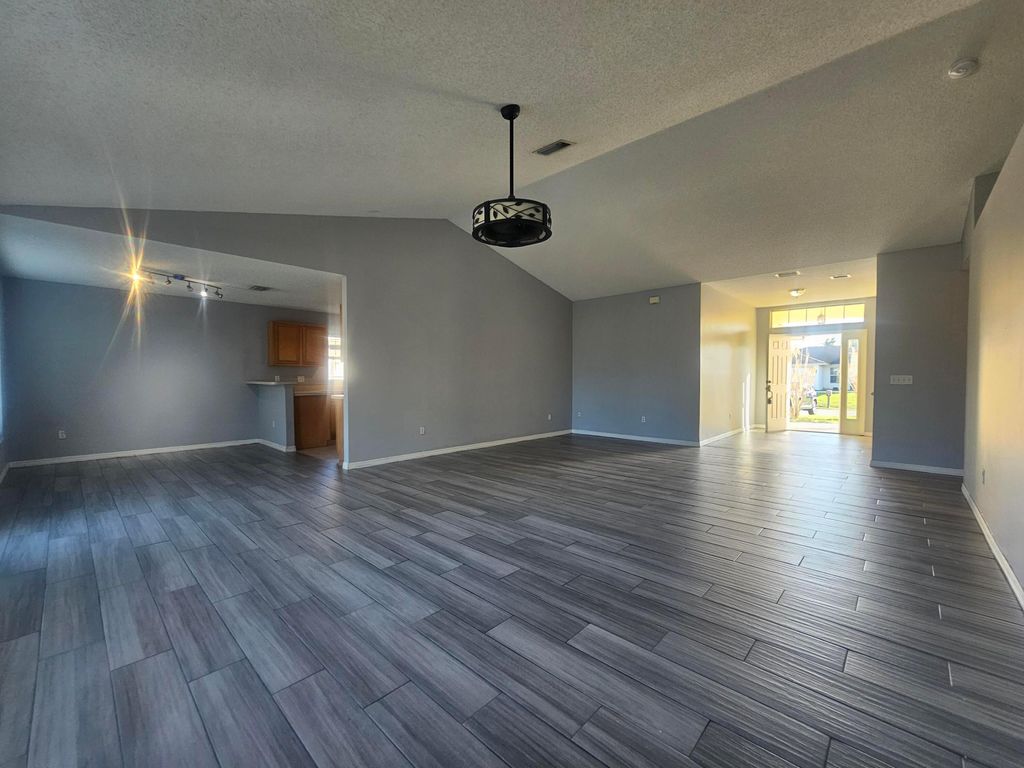Photo of 1941 SW Hampshire Lane, Port Saint Lucie, FL 34953 (MLS # B26027623)