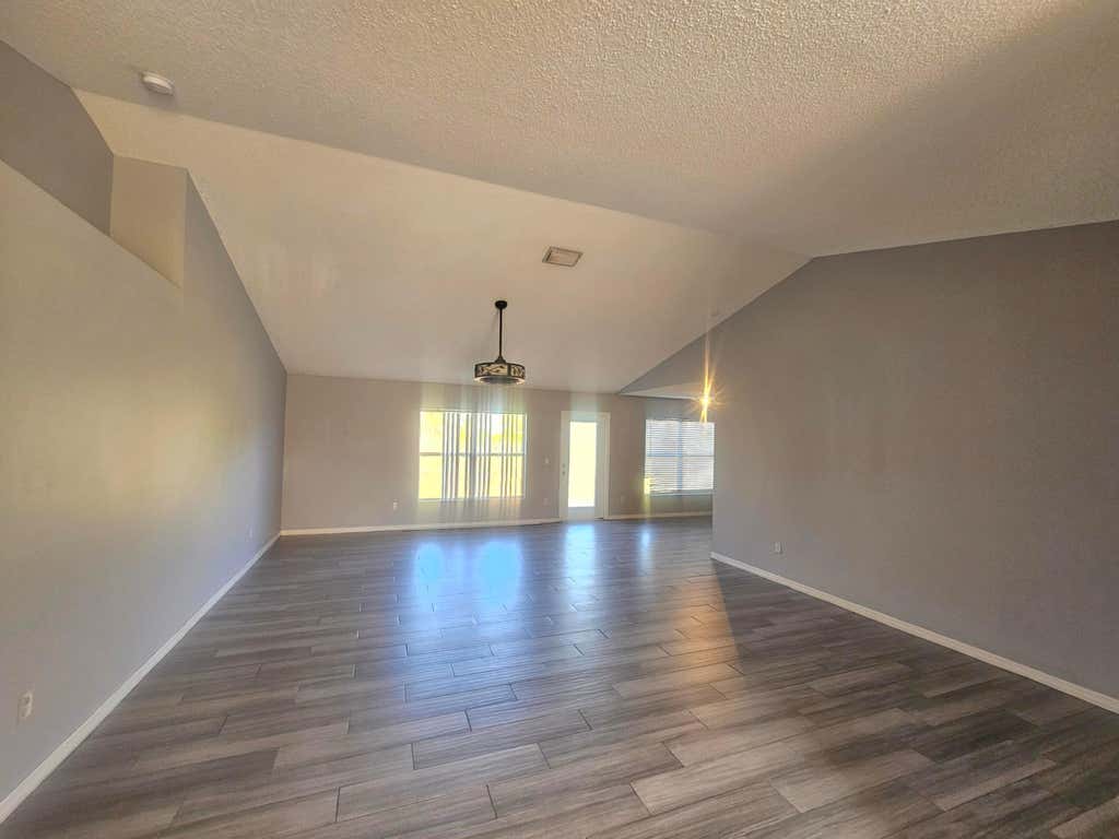Photo of 1941 SW Hampshire Lane, Port Saint Lucie, FL 34953 (MLS # B26027623)