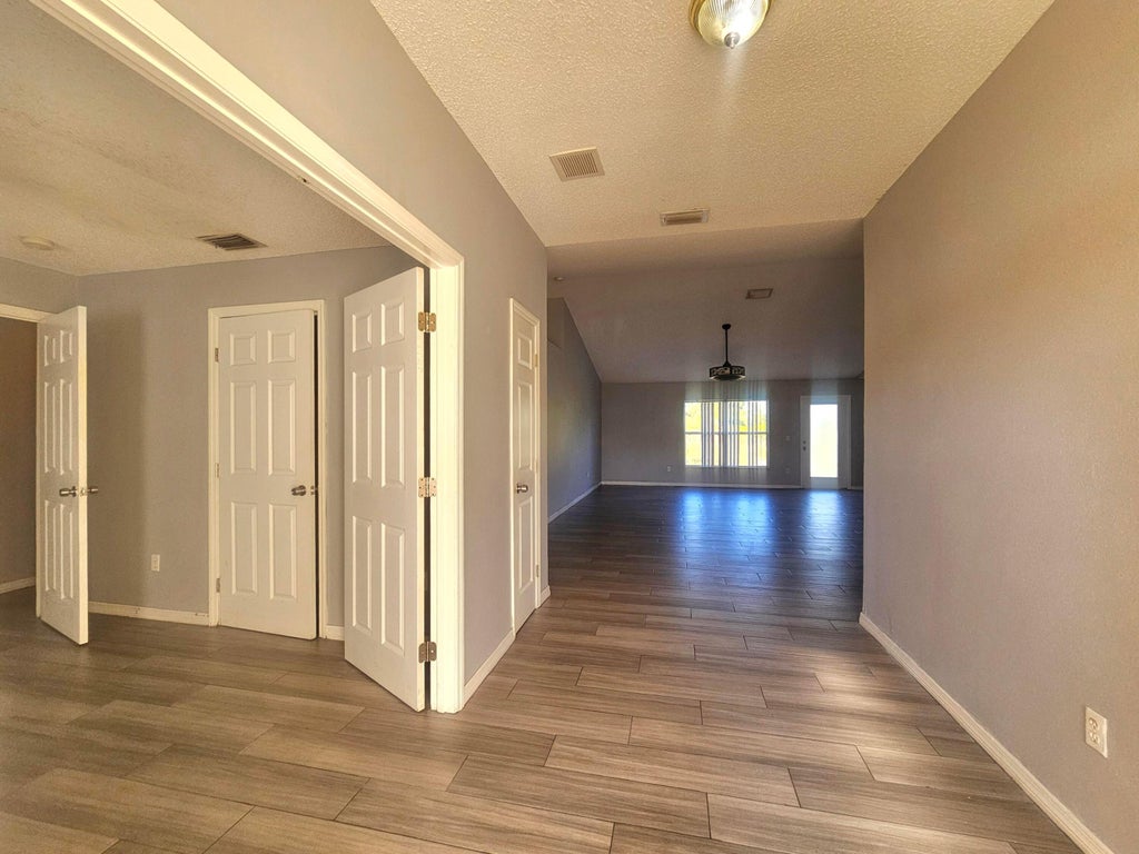 Photo of 1941 SW Hampshire Lane, Port Saint Lucie, FL 34953 (MLS # B26027623)