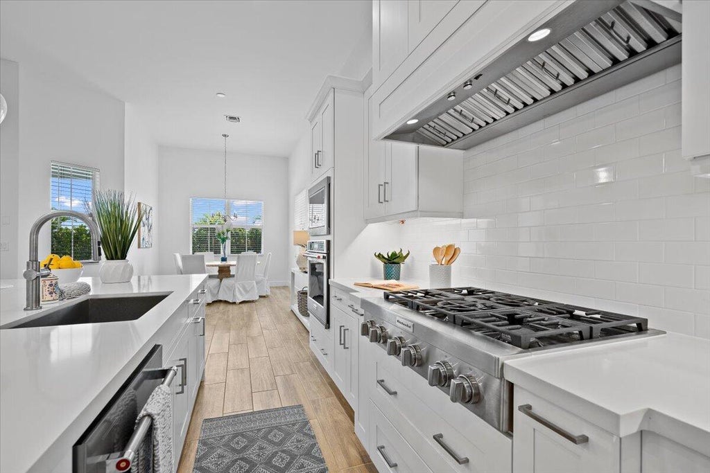 Photo of 12538 Nautilus Circle, Palm Beach Gardens, FL 33412 (MLS # B26089669)