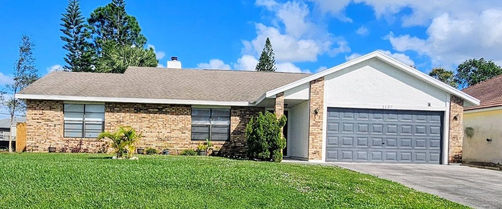 Photo of 1137 SW Estaugh Avenue, Port Saint Lucie, FL 34953 (MLS # R11139342)