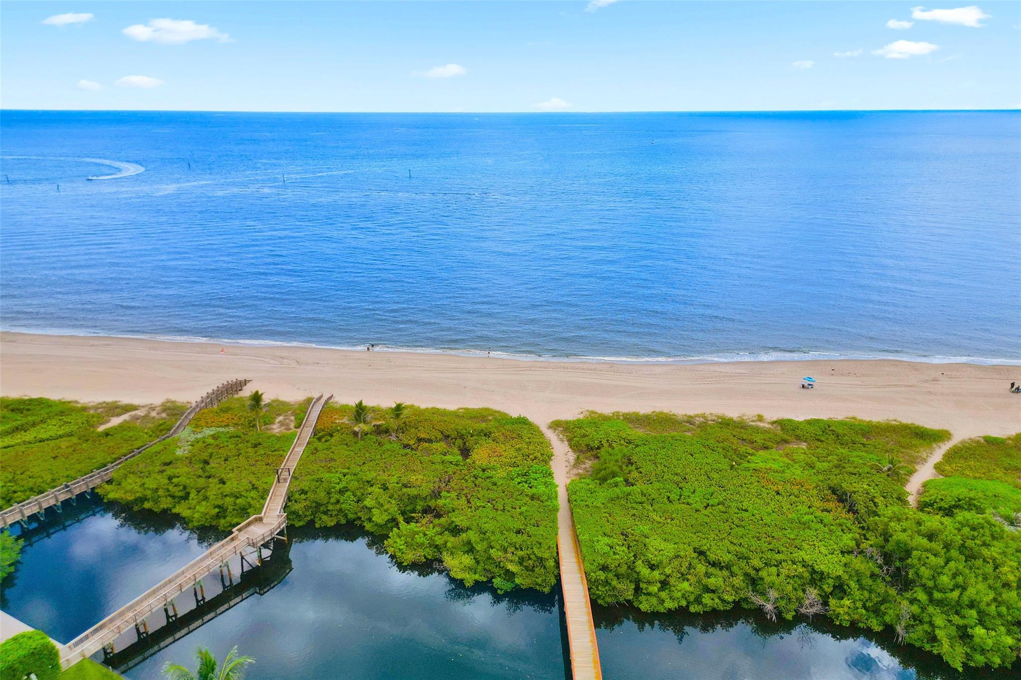 Want to live by the ocean? Come home to this beautiful Hillsboro Bay By The Sea townhome community, situated in the coveted oceanside enclave Hillsboro Shores in Pompano Beach. Substantially renovated residence exudes luxury & thoughtful features to capture your heart, including: spectacular chef's kitchen, wood flooring, custom built-ins & closets, private elevator, frosted interior doors, tankless water heater, central vac, impact windows & doors, and so much more. Saturated in natural light, this 4BR/3.5BA/2CG has generous rooms throughout, 16' ceilings, and ocean views from LR & primary BR balcony. Escape to your private backyard paradise featuring new pool & natural stone waterfall, travertine deck. Private gated beach access. Come view this one, you won't want to leave!