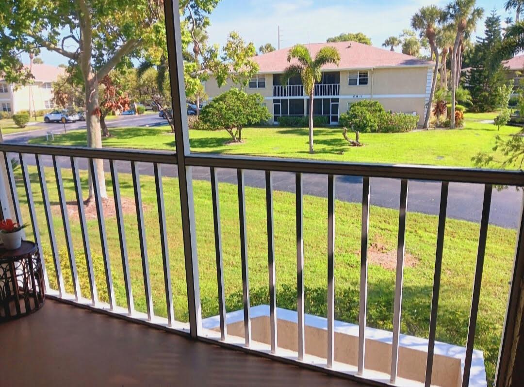 IMMACULATE! GARDEN VIEWS FROM ALL BEDROOMS & PATIO! No Parking lot view.  Larger unit of 2/2. Corner unit, no units attached to bedroom side. Move IN Ready. AC REPLACED 2024. WATER HEATER REPLACED 2024: Drain valve made of brass, not plastic. Both energy efficient:.  Fridge replaced 2023. LARGE TILES THROUGHOUT, 19X19, No Carpet! TILED BACKSPLASH IN KITCHEN. Textured countertops. Chestnut colored Cabomets. Breakfast Bar. In-unit washer/dryer. NEUTRAL PAINT colors. ROOF REPLACED in 2021. ALL BLDGS were Paintied  2023. HOA Fees: incd. Water, Maintenance, Landscaping, roof, building insurance, Mgmt Co., garbage pick up.JUST A FEW STEPS from HEATED POOL. Pet friendly. Rental allowed, no wait period. TRUCKS ALLOWED. W/Rest. All ages community. Don't Miss Out  on this UPGRADED HOME !