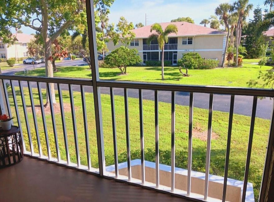 IMMACULATE! GARDEN VIEWS FROM ALL BEDROOMS & PATIO! No Parking lot view.  Larger unit of 2/2. Corner unit, no units attached to bedroom side. Move IN Ready. AC REPLACED 2024. WATER HEATER REPLACED 2024: Drain valve made of brass, not plastic. Both energy efficient:.  Fridge replaced 2023. LARGE TILES THROUGHOUT, 19X19, No Carpet! TILED BACKSPLASH IN KITCHEN. Textured countertops. Chestnut colored Cabomets. Breakfast Bar. In-unit washer/dryer. NEUTRAL PAINT colors. ROOF REPLACED in 2021. ALL BLDGS were Paintied  2023. HOA Fees: incd. Water, Maintenance, Landscaping, roof, building insurance, Mgmt Co., garbage pick up.JUST A FEW STEPS from HEATED POOL. Pet friendly. Rental allowed, no wait period. TRUCKS ALLOWED. W/Rest. All ages community. Don't Miss Out  on this UPGRADED HOME !