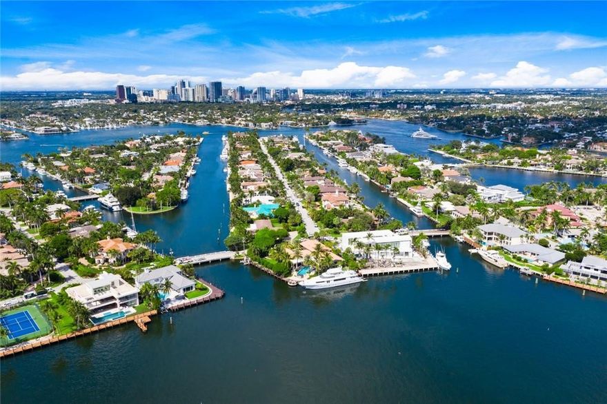 Highly desirable eastern exposure point residence in prestigious security patrolled Harbor Beach offers private beach club & marina.Prime 250ft+/- deepwater dockage perfect for large or multiple yachts.Trophy point properties now rarely available under $10mm!Beautifully presented Key West inspired residence offers stunning & incredible wide open views & breezes on Lake Sylvan.6 ft flood elevation.Flexible floorplan open kitchen & living areas with high ceiling heights. 1st level one bedroom suite + adjoining library/media/playroom. 2nd level master & bedroom suite. GROUND UP RENOVATION 1995 + Roof 2020,4 new A/C 2018, dock 2019, impact glass windows, hardwood floors, plantation shutters,higher ceilings add to island vibe.Expansion plans available.Outdoor areas include large custom pool