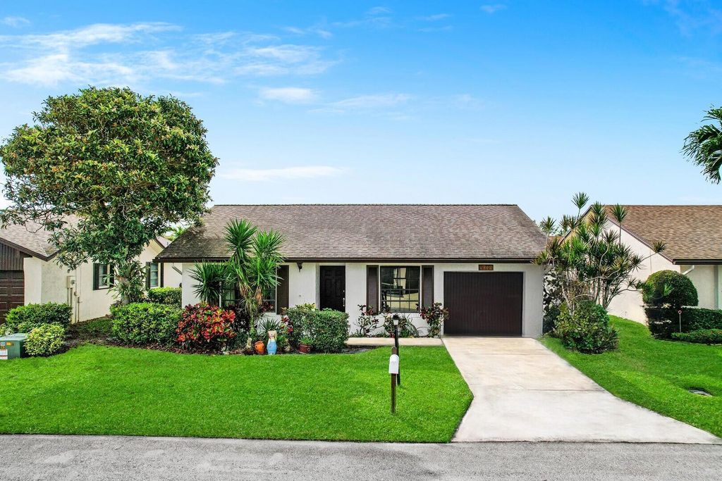 Photo of 6306 White Sabal Palm Lane, Greenacres, FL 33463 (MLS # R10995891)