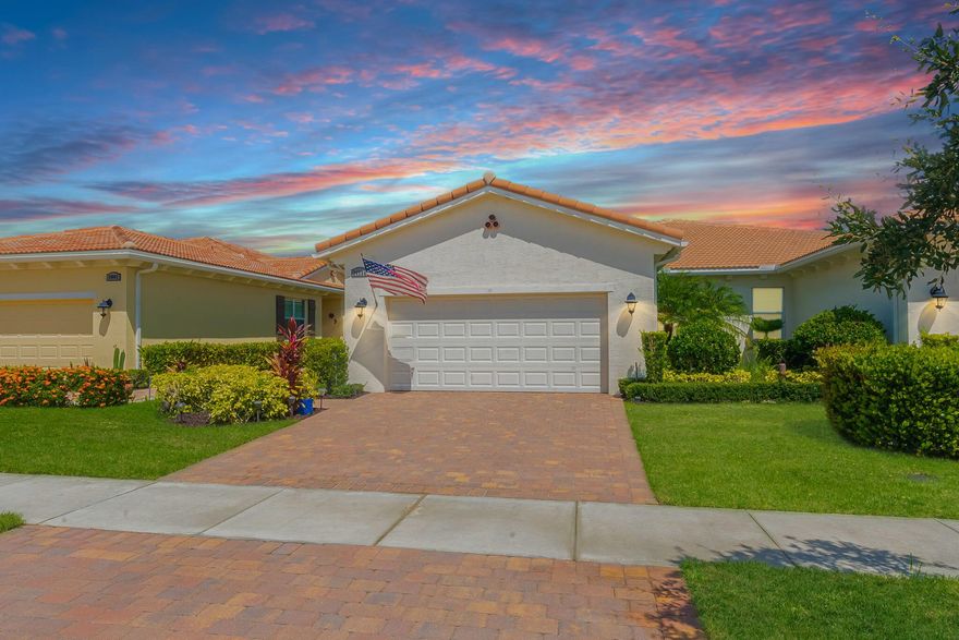 FABULOUS LAKEFRONT VILLA IN PGA VERANO! Elegant 2BR/2BA/2CG plus versatile flex room. Stylish open layout with crown molding, high-impact windows, and sleek tile floors in main areas. Chef's kitchen boasts quartz counters, 42'' wood cabinetry, stainless steel appliances, and breakfast bar. Spacious great room flows to the covered, screened lanai--perfect for relaxing and enjoying serene lake views. Luxe owner's suite with dual vanities and walk-in shower. Flex space ideal for office  guest space. Enjoy the ultimate resort lifestyle with world-class amenities including pools, fitness center, courts, social clubs & more!