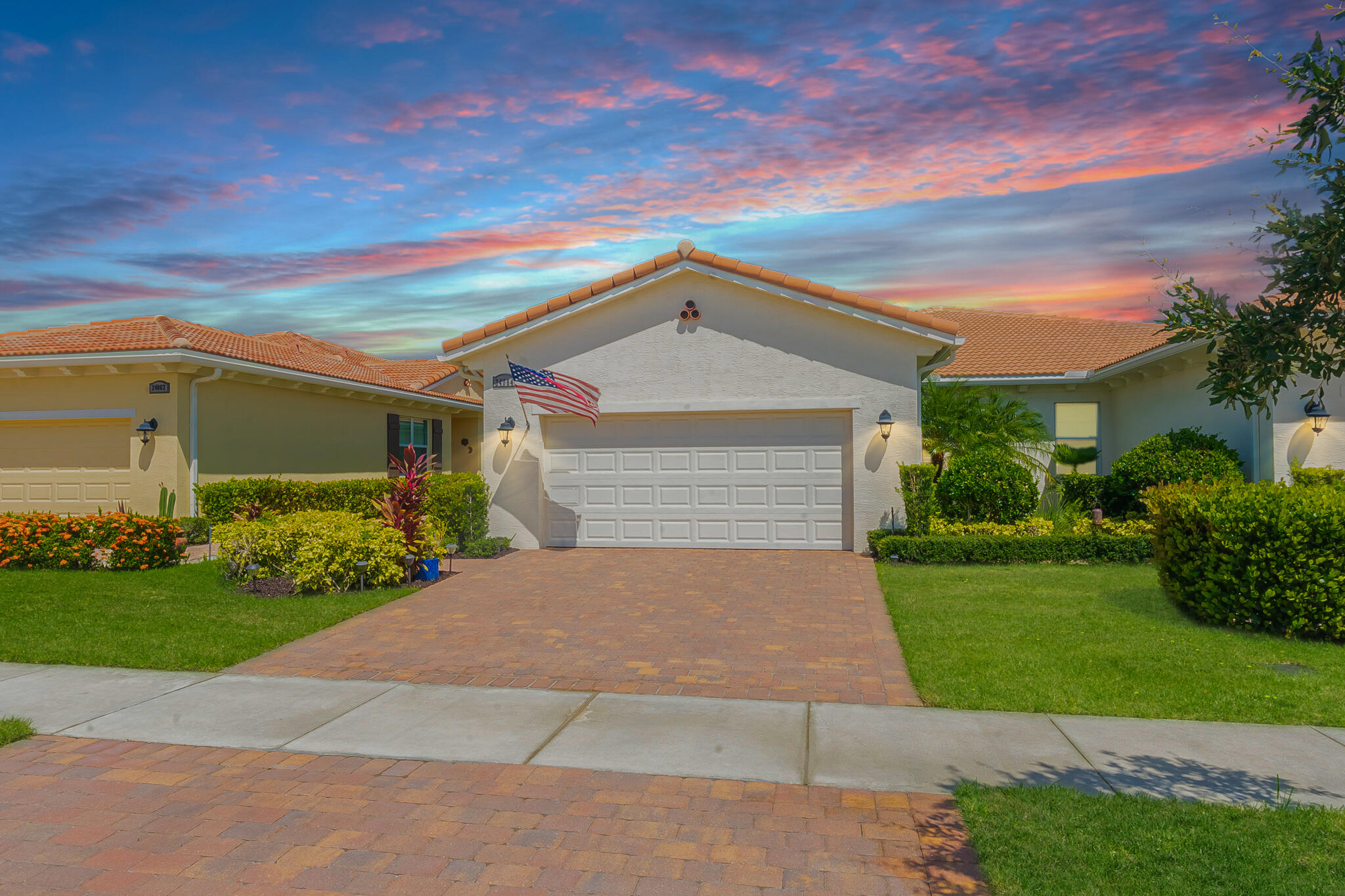 FABULOUS LAKEFRONT VILLA IN PGA VERANO! Elegant 2BR/2BA/2CG plus versatile flex room. Stylish open layout with crown molding, high-impact windows, and sleek tile floors in main areas. Chef's kitchen boasts quartz counters, 42'' wood cabinetry, stainless steel appliances, and breakfast bar. Spacious great room flows to the covered, screened lanai--perfect for relaxing and enjoying serene lake views. Luxe owner's suite with dual vanities and walk-in shower. Flex space ideal for office guest space. Enjoy the ultimate resort lifestyle with world-class amenities including pools, fitness center, courts, social clubs & more!
