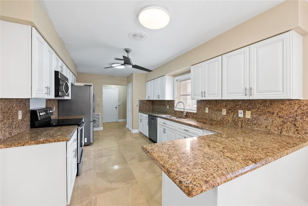 Photo of 10911 Greentrail Drive, Boynton Beach, FL 33436 (MLS # F10531432)