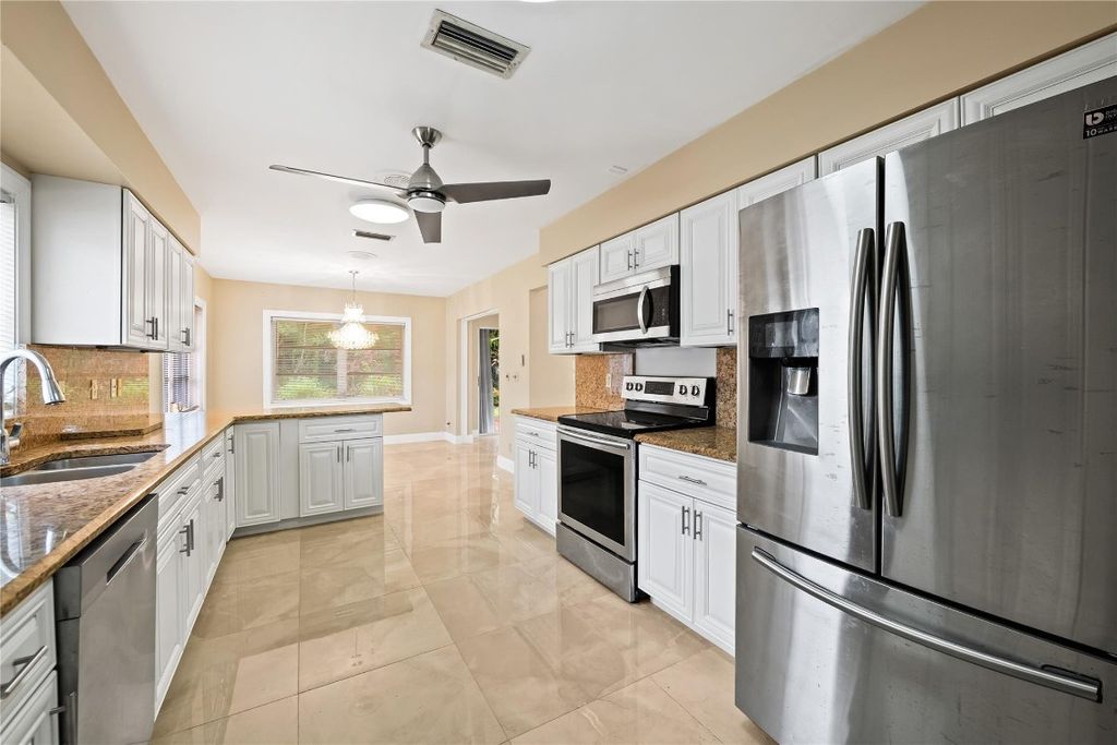 Photo of 10911 Greentrail Drive, Boynton Beach, FL 33436 (MLS # F10531432)