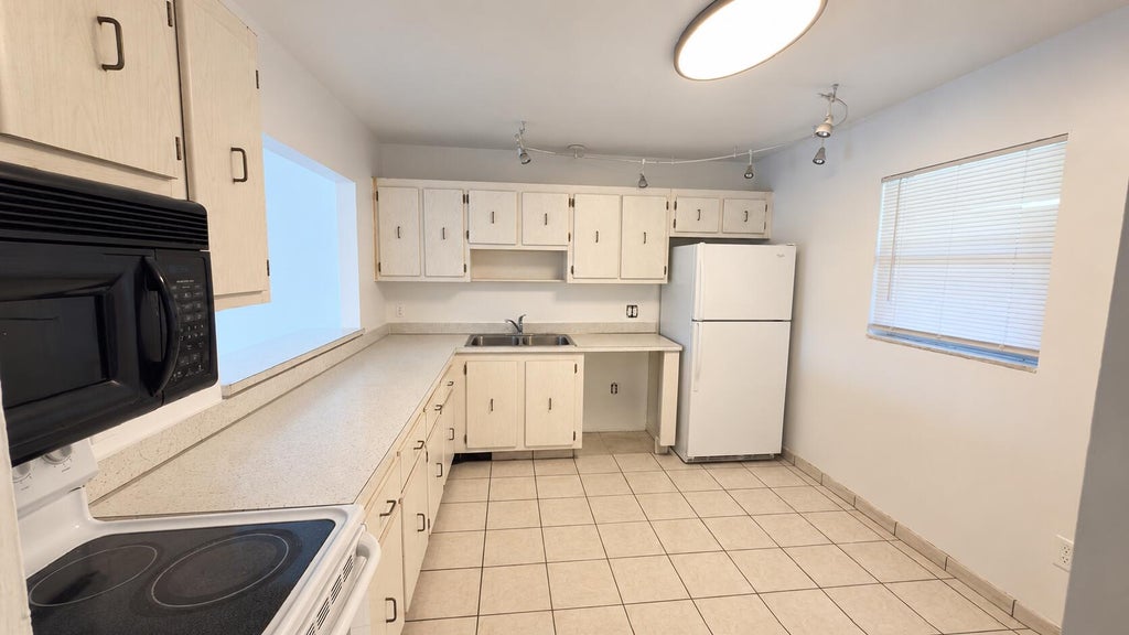 Photo of 4131 STIRLING RD #305, Dania Beach, FL 33314 (MLS # B26076608)