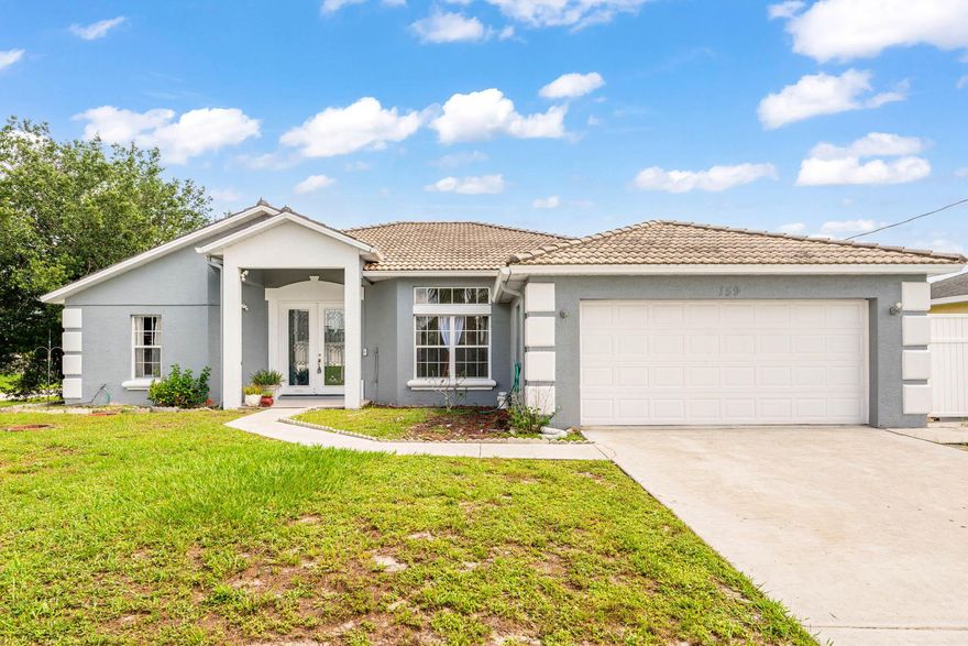 Enjoy multi-family living or rental income in this grand corner lot home located near the turnpike and I-95 in Port St Lucie. Last tenant was paying $1125 per month. The studio offers private parking and private entry. The main home is a 3/2/2 with custom architectural ceilings, split floor plan, hurricane impact 8 ft double front doors, open kitchen, breakfast area, formal dining room, and a custom kitchenette in the master bedroom with an inground gas heated swimming pool and spa! Gas heated stove, and hot water heater also! Schedule your showing today!