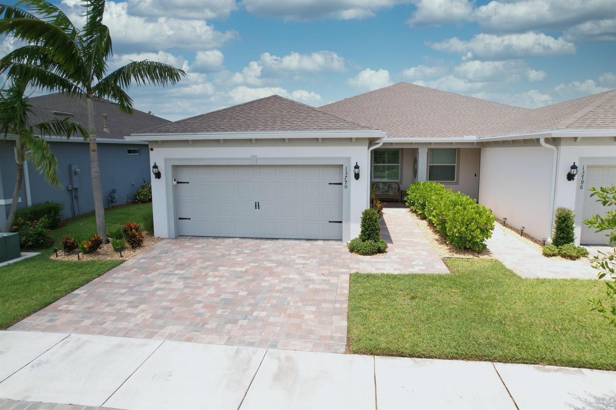 Stunning Waterfront Villa. Ready to move into, no need to wait to build. Impact windows and doors. Highly upgraded with custom cabinets, backsplash, granite and an Island in the kitchen. New gas stove upgraded with air fry feature. Tile throughout the entire home. Plantation shutters plus an electric shade for the sliders. Master bath has duals sinks and a shower with frameless doors. Huge walk-in closet with built in organizers. Flex Room perfect for den or an office. Custom glass front door with fantom screen. Expanded Screened Patio overlooking the lake. Extra pavers added for grilling area. Extensive landscaping with rocks, no mulch! Epoxy flooring in garage. Active 55+ Community with full time Lifestyle Director. Two pools, pickleball,tennis,putting green, bocce , gym, walking trail