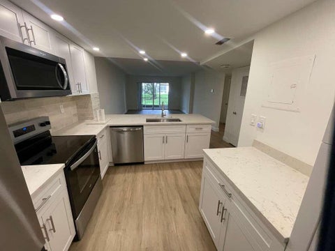 Photo of 1200 NW 87th Avenue #115, Coral Springs, FL 33071 (MLS # B26037114)