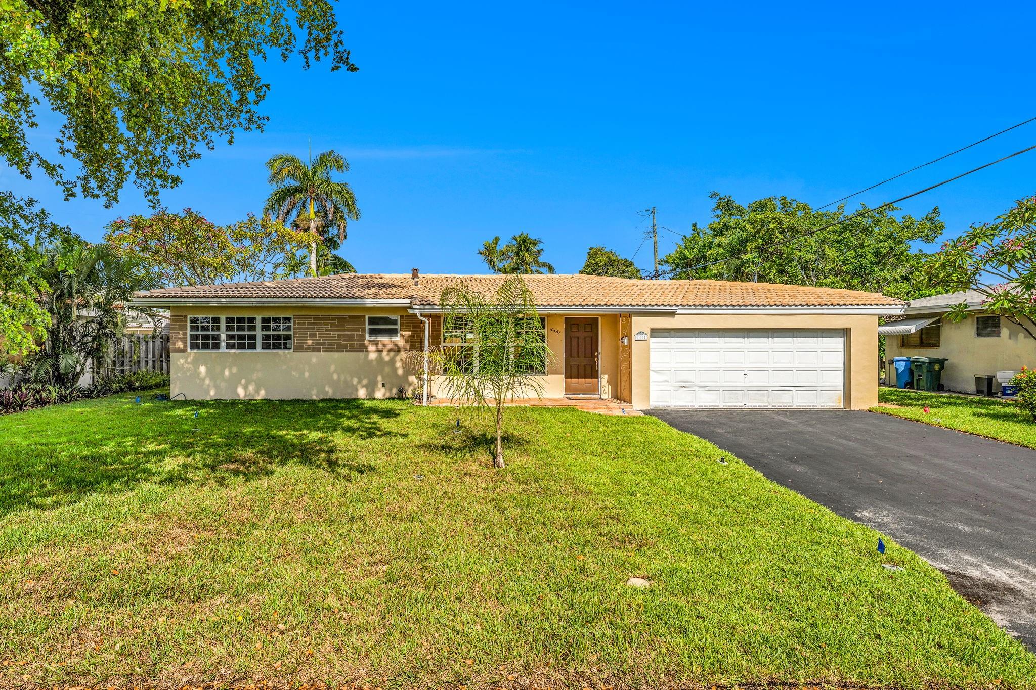 Mid-Century / Old Florida charm looking for your personal touches. 3/3 split layout. (3rd bedroom makes a great in-law suite or efficiency. This room has a private entrance, full bath, kitchenette, wood burning fireplace and access to backyard patio). Home features include; natural gas (stove and hot water heater), partial impact windows and panels, polished terrazzo flooring, updated electric panel, central A/C (2015), main roof (barrel tile approx. 26 years old), new lawn irrigation system and sod, interior and exterior freshly painted, 2 car garage plus resurfaced driveway with parking for up to 4 cars. This spacious home has endless possibilities and is PRICED TO SELL! Main house has Central A/C although some wall units are still in place. Efficiency has a wall unit a/c.