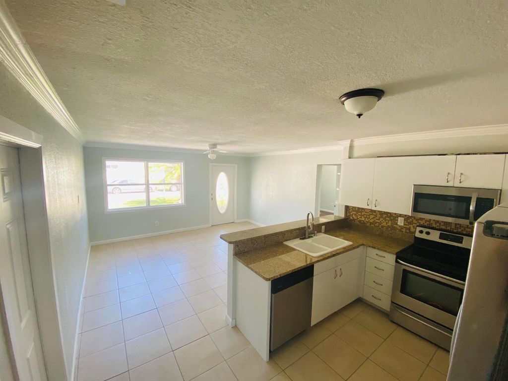 Photo of 2831 Scanlan Avenue, Lake Worth, FL 33461 (MLS # R10937276)