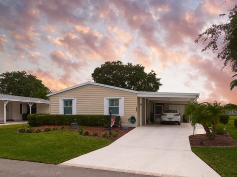 Photo of 7849 Meadowlark Lane, Port Saint Lucie, FL 34952 (MLS # B26042103)