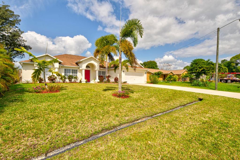 Photo of 1029 SW Bay State Road, Port Saint Lucie, FL 34953 (MLS # R10977172)