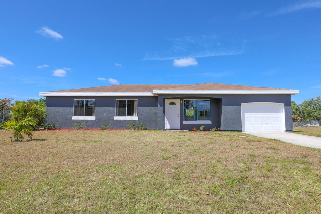 Photo of 250 SW Homeland Road, Port Saint Lucie, FL 34953 (MLS # R10979984)