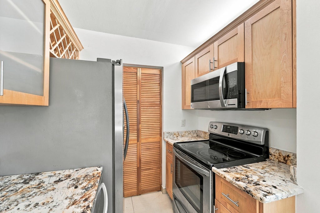 Photo of 2907 NE 8TH Terrace #201, Oakland Park, FL 33334 (MLS # B26094800)