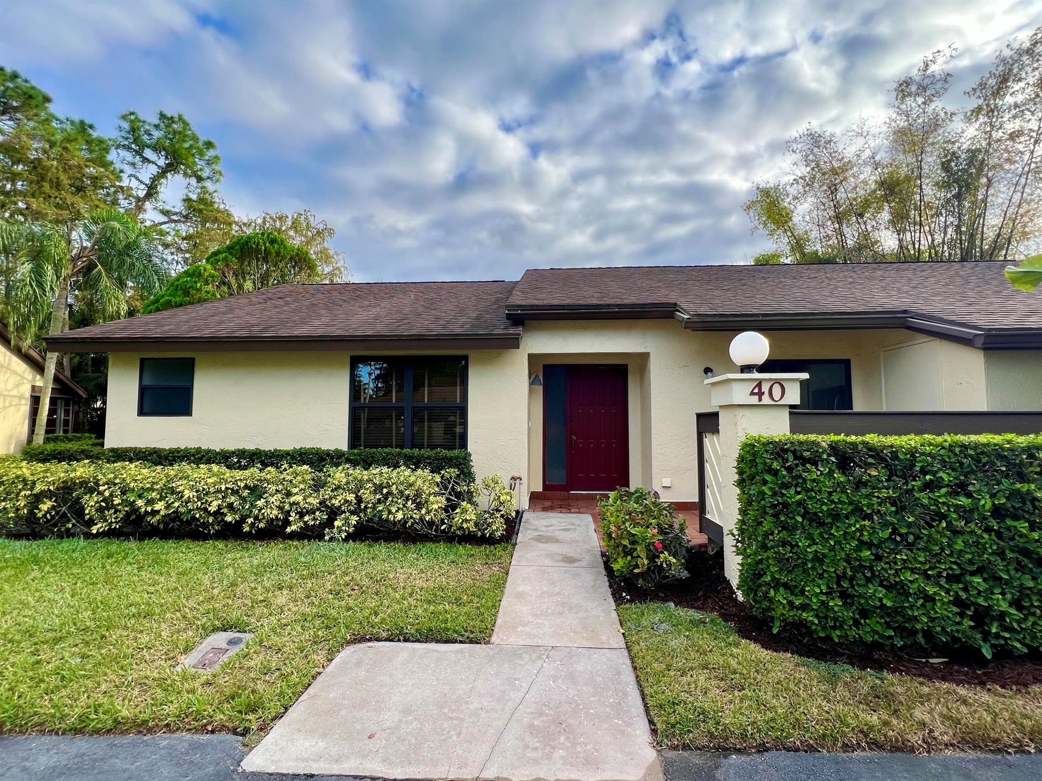 Welcome to this renovated 3 bed, 2 bath Villa in the heart of Royal Palm Beach. This property has been tastefully renovated; from the moment you walk in you will be delighted; this beautiful villa features 42' white kitchen cabinets, quartz countertops, matte porcelain tile backsplash and laminate flooring throughout. A/C is from 2021, NEW Electrical panel and NEW water heater. This ready to move in Villa is located in the desirable 55+ Community Strathmore Gate, steps away from parks, shops, restaurants and much more! WHY WAIT?! COME SEE THIS HOME TODAY!