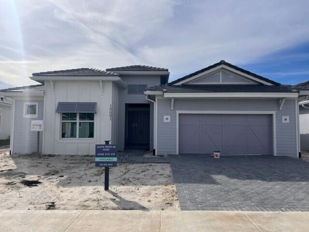 Photo of 10001 Seagrass Way, Palm Beach Gardens, FL 33412 (MLS # R10929694)