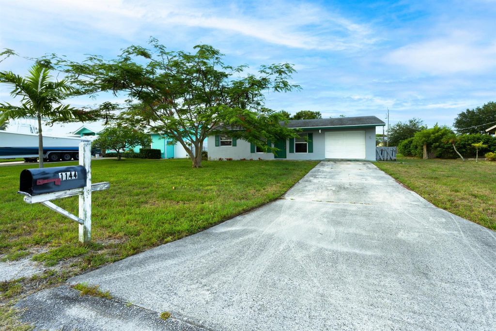 Photo of 1144 NE Crown Terrace, Jensen Beach, FL 34957 (MLS # R11091288)