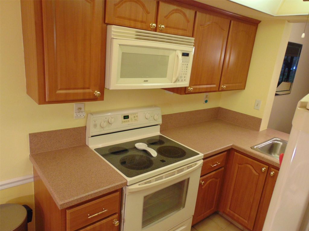Photo of 1969 SW 15th St #99, Deerfield Beach, FL 33442 (MLS # F10531311)