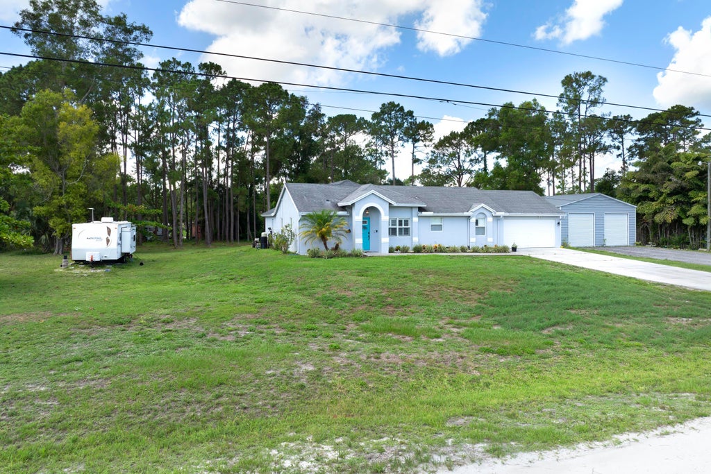 Photo of 14676 N 86th Road N, The Acreage, FL 33470 (MLS # R11100311)