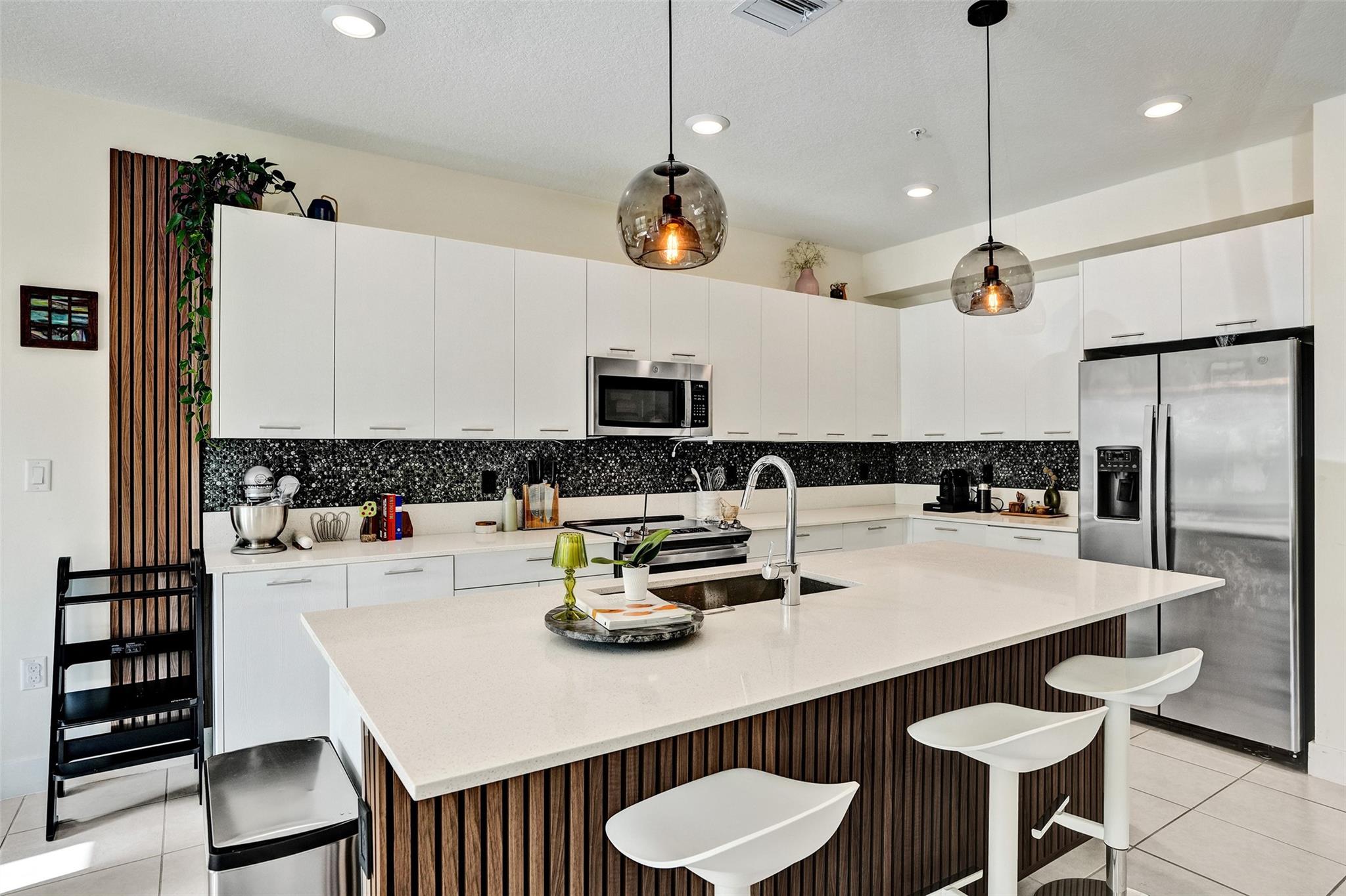 This stunning two-story unit offers spacious living with oversized bedrooms, a laundry room, ample storage, and two convenient private entrances on the first floor (front and back). Featuring an open floor plan, impact windows and doors, walk-in closets, and a gourmet kitchen complete with stainless steel appliances, quartz countertops, and a large island with breakfast bar perfect for entertaining. Enjoy resort-style living with access to a luxurious clubhouse offering a sparkling pool, kids’ splash pad, gym, indoor basketball court, billiard room, game room, party space, and more. Ideally located within walking distance to Downtown Doral’s vibrant dining scene, shopping, entertainment, and top-rated charter schools. Quick access to major highways.
