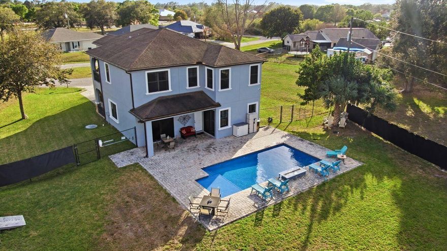 Discover this stunning custom-built home tucked away on a peaceful cul-de-sac in Port St. Lucie. Offering 5 bedrooms, 4 bathrooms, and a 3-car garage, this residence blends space, style, and comfort. Inside, tray ceilings and wood-look tile flooring flow throughout beautifully designed living areas filled with custom touches. The chef's kitchen shines with marble countertops, stainless steel appliances, and a custom wet bar perfect for entertaining. The spacious primary suite features his-and-hers walk-in closets and dual vanities. Step outside to your private pool—ideal for relaxing or hosting gatherings year-round. Complete with an interior and exterior security system, this home delivers comfort, privacy, and the Florida lifestyle all in one.