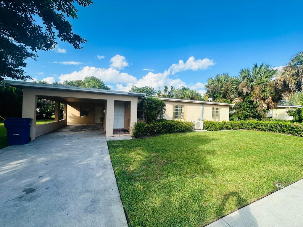 Photo of 1572 W 10th Street, Riviera Beach, FL 33404 (MLS # B26093298)