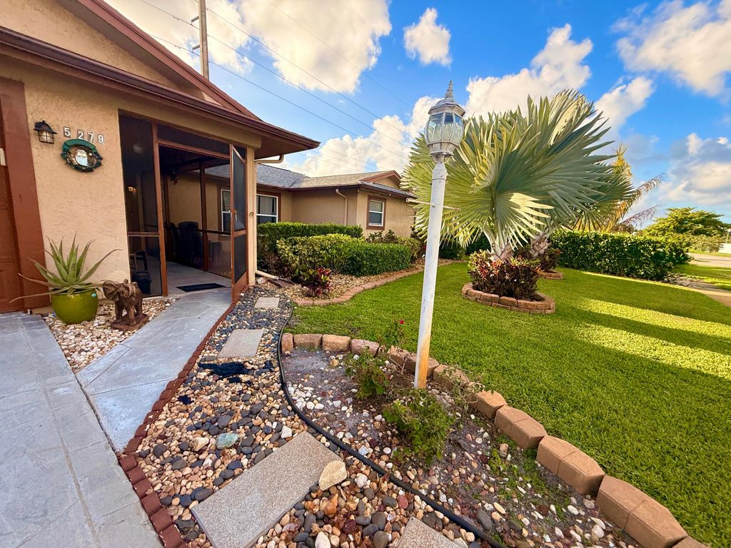 Photo of 5279 W Woodstone Cir Circle W, Lake Worth, FL 33463 (MLS # B26011523)