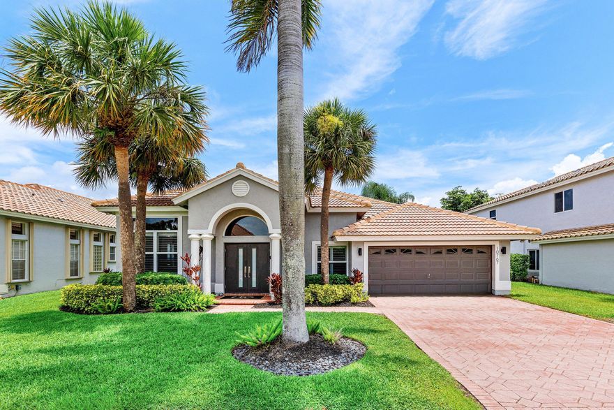 Beautifully renovated lakefront home in the desirable, family-friendly Boca Isles community. This light-filled residence features soaring ceilings, an open floor plan, bamboo wood flooring, recessed lighting, impact windows, & a flexible front room ideal for an office, den, or playroom. The updated kitchen opens to the family room & offers granite countertops and stainless steel appliances. All bathrooms have been remodeled, including the primary suite with a Jacuzzi tub & dual walk-in closets. Major updates include a 2017 roof and 2019 A/C. Spacious backyard with room for a pool. Low HOA includes cable, high-speed internet, clubhouse, gym, pool, tennis, new pickleball courts, playground, and social room. Gated community near A-rated schools, shopping, dining, & South County Regional Park