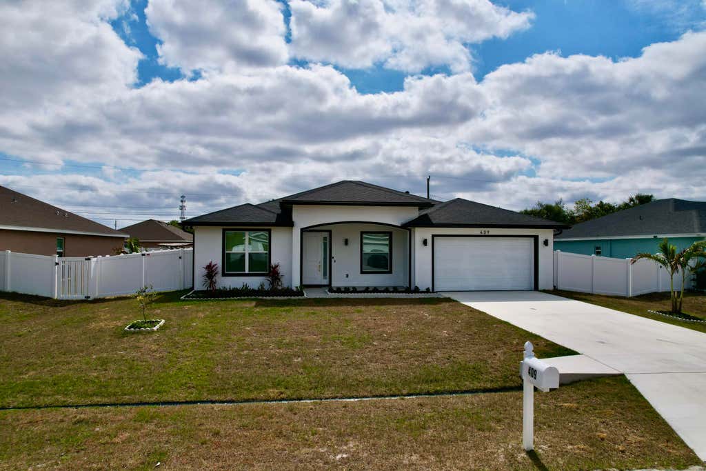 Photo of 409 SW Bradshaw Circle, Port Saint Lucie, FL 34953 (MLS # R11086731)