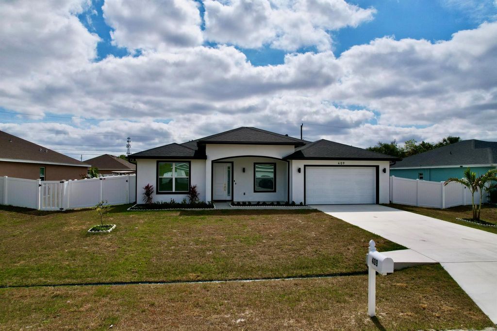 Photo of 409 SW Bradshaw Circle, Port Saint Lucie, FL 34953 (MLS # R11086731)