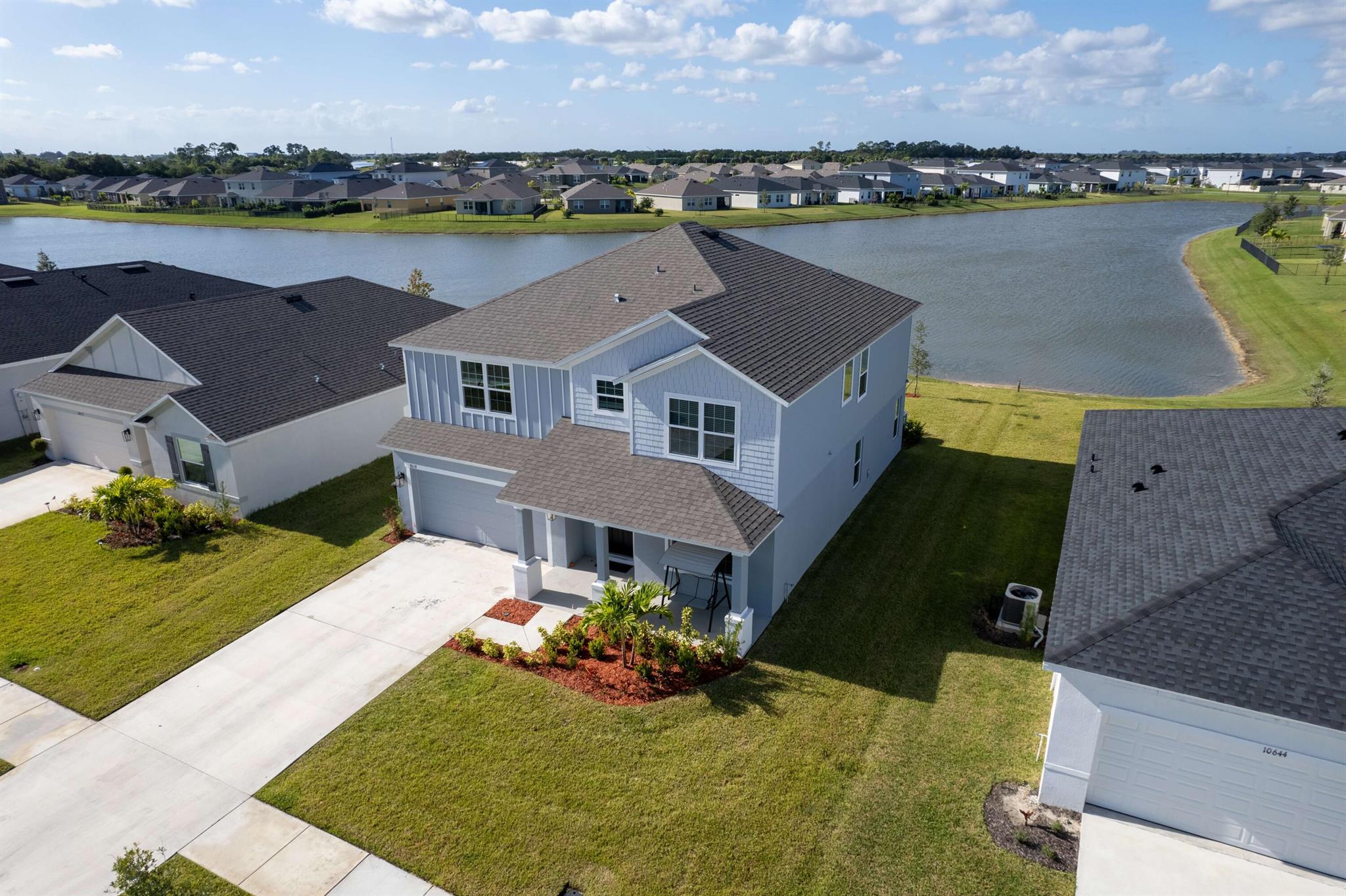 This stunning 4-bedroom, 3-bathroom residence offers over 3,200 sqft under air and 3,679 total sq. ft. of beautifully designed living space. Step inside and you'll find a bright, open layout with a spacious great room, gourmet kitchen, and flexible loft--perfect for entertaining or relaxing with family. Enjoy peace of mind with solid CBS construction and stylish finishes throughout. The home also features a screened outdoor patio, and water view ideal for evening gatherings or morning coffee. Located in the highly desirable Crosstown Commons, residents enjoy low HOA fees, a sparkling community pool, playground, cabana, and sidewalks for easy strolls. Plus, you're just minutes from shopping, dining, and recreation in Tradition, with quick access to I-95 and the Florida Turnpike for commuter