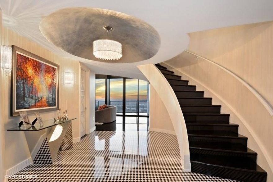 One-of-a-kind 2-Story Penthouse w/ private elevator showcasing some of the most spectacular views Fort Lauderdale has to offer. Dramatic double height ceiling adds to the grandeur of this sexy, contemporary residence embraced by walls of floor-to-ceiling glass & huge wrap-around balcony. Sleek European kitchen, amazing family room & expansive 2nd floor master suite.Unit comes with one assigned premium garage space & one valet space. A second garage space & storage room can be purchased if desired.