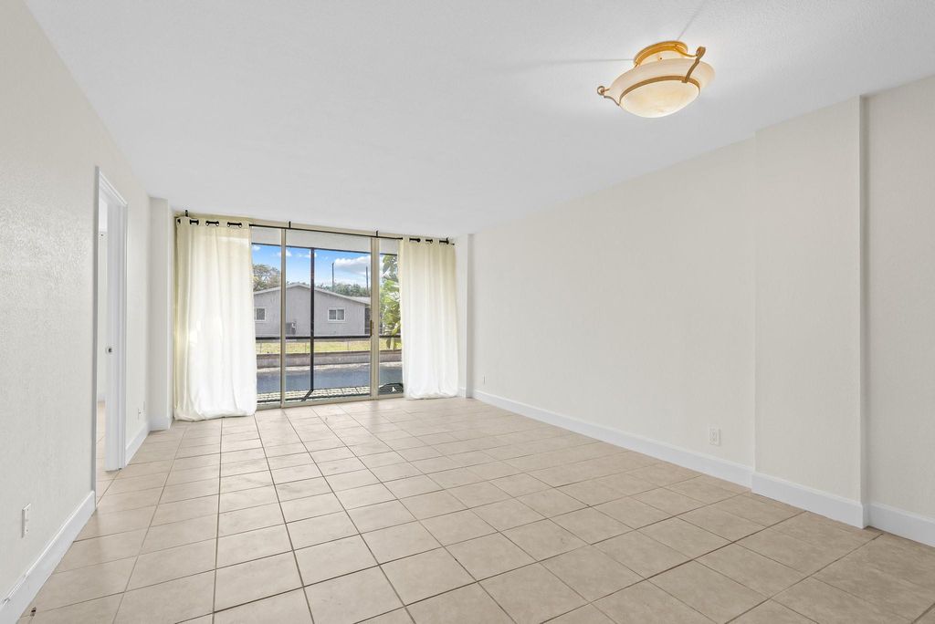 Photo of 111 Royal Park Dr #1C, Oakland Park, FL 33309 (MLS # F10516314)