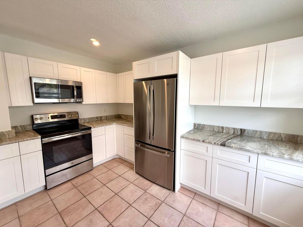 Photo of 11319 Royal Palm Boulevard #B-2, Coral Springs, FL 33065 (MLS # B26010803)