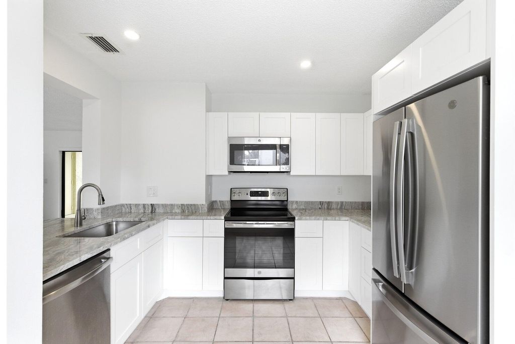 Photo of 11319 Royal Palm Boulevard #B-2, Coral Springs, FL 33065 (MLS # B26010803)