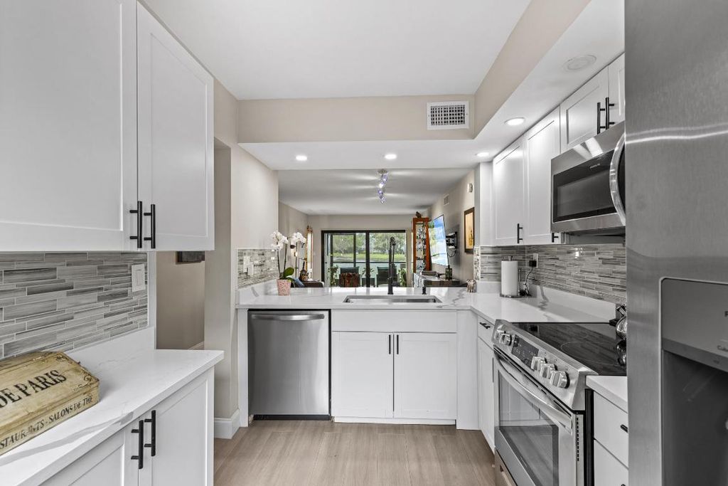 Photo of 12829 Briarlake Drive #102, Palm Beach Gardens, FL 33418 (MLS # R11096952)