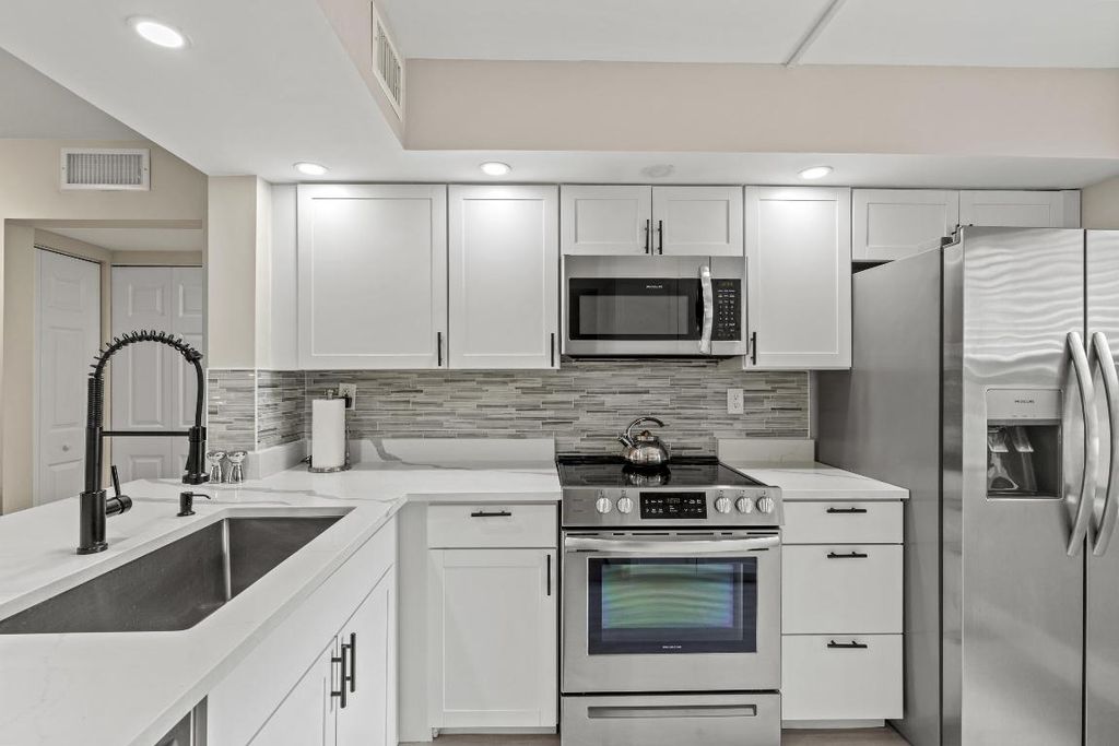 Photo of 12829 Briarlake Drive #102, Palm Beach Gardens, FL 33418 (MLS # R11096952)