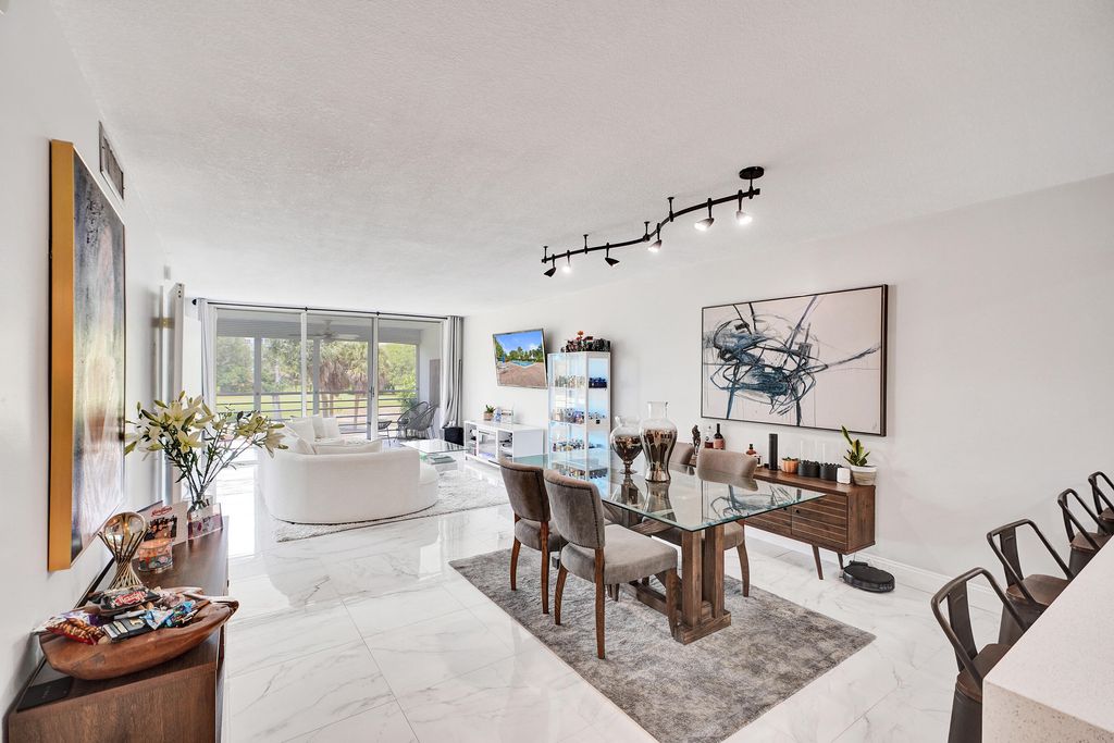 Photo of 545 Oaks Lane #204, Pompano Beach, FL 33069 (MLS # B26024083)