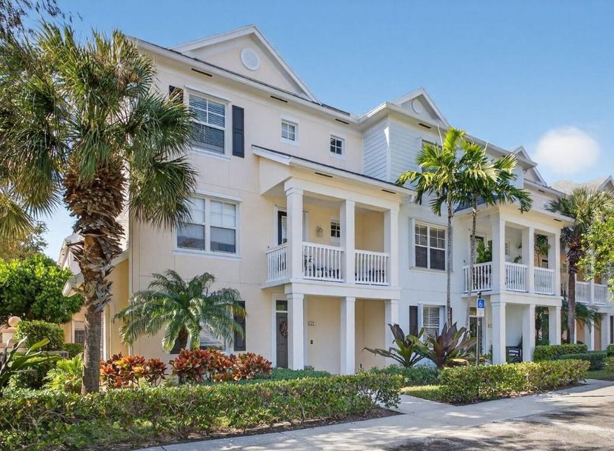 Corner-unit townhome in Abacoa features  3 floors of well-designed living with lots of windows and light. The ground level features a large flex room ideal for a home office, den, or gym, plus a two-car garage. Second floor showcases  a large bedroom, a full bath and an open kitchen with stainless steel appliances, granite countertops, tiled backsplash, and wood cabinetry, flowing into a dining room highlighted by a copper tray ceiling and elegant wainscoting. The living room opens to a private balcony with a view of the pool.  Crown molding adds refined detail throughout. The third floor offers two en suite bedrooms, a versatile loft, and convenient laundry. Hurricane-impact windows and doors throughout provide peace of mind and efficiency. Pool, gym and playground across the street.