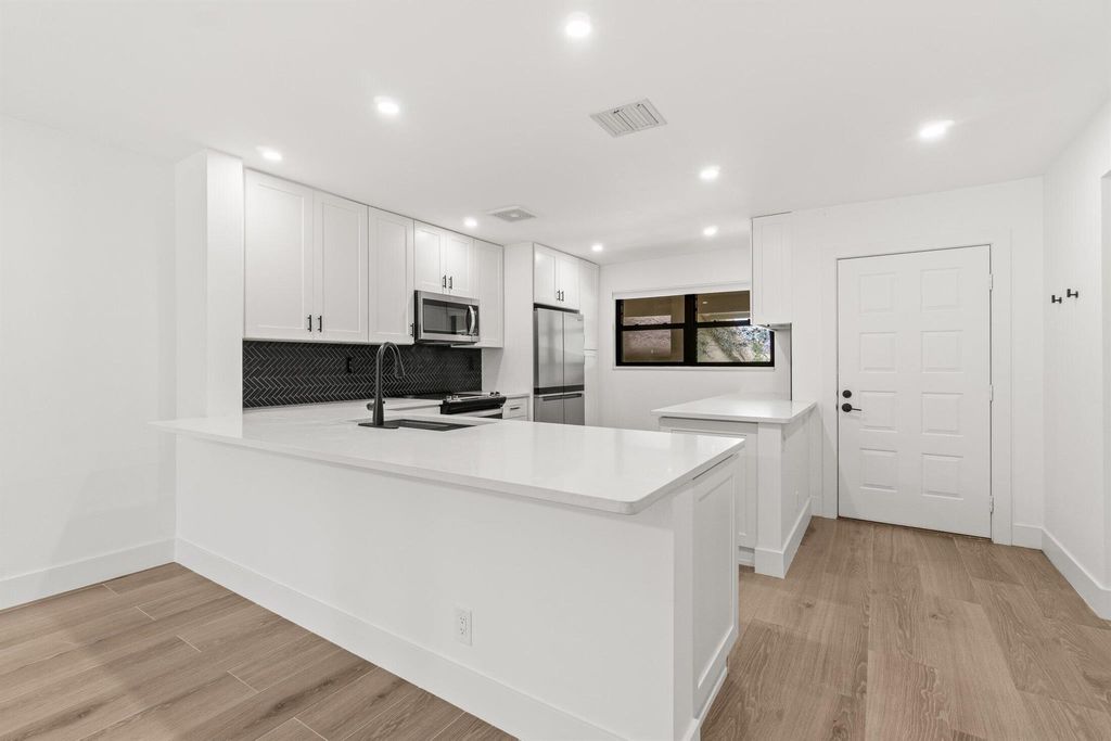 Photo of 12910 Briarlake Drive #201, Palm Beach Gardens, FL 33418 (MLS # R11106017)